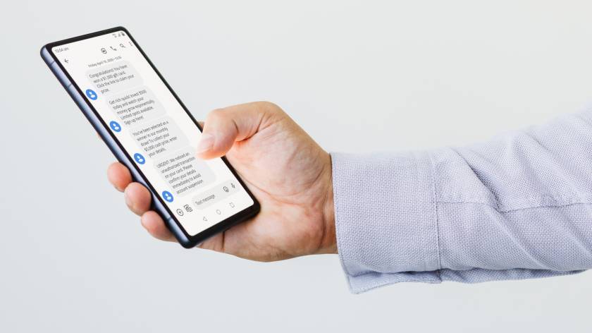 Smartphone showing text messages as new rules mean business SMS may be labelled ‘Unverified’