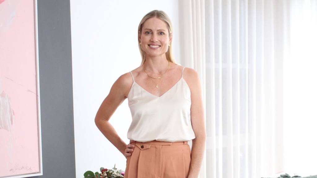 Empowered Mother founder Kimberley Smith standing in a bright studio space